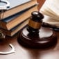 Criminal Defense Attorneys - Law books, handcuffs, and gavel