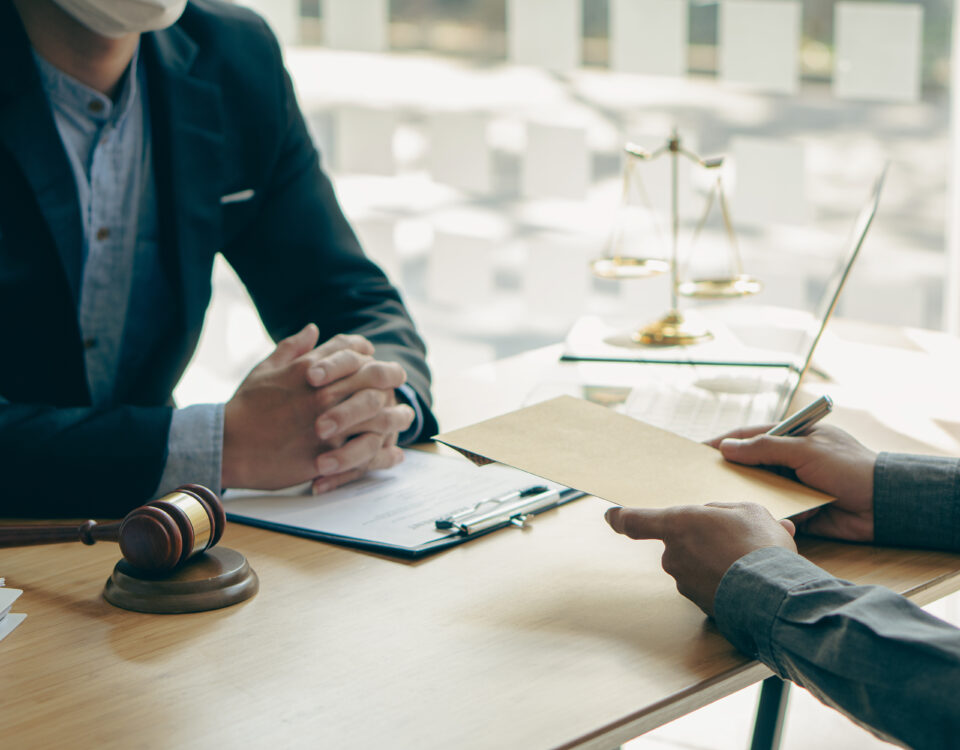 Defendant interviewing a criminal defense lawyer before making a decision on who should represent them.