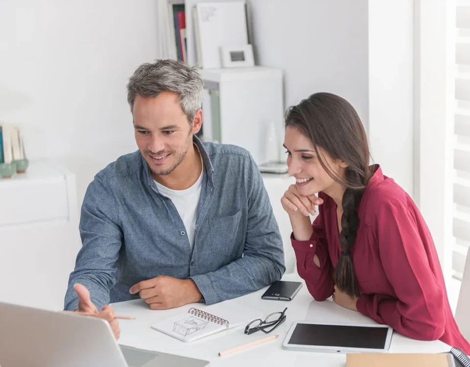 Man and woman working together on computer